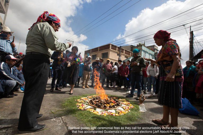 Spiritual guides light ceremonial fires as they call for accountability in the political crisis that has accompanied Guatemala’s presidential elections [Jeff Abbott/Al Jazeera]
